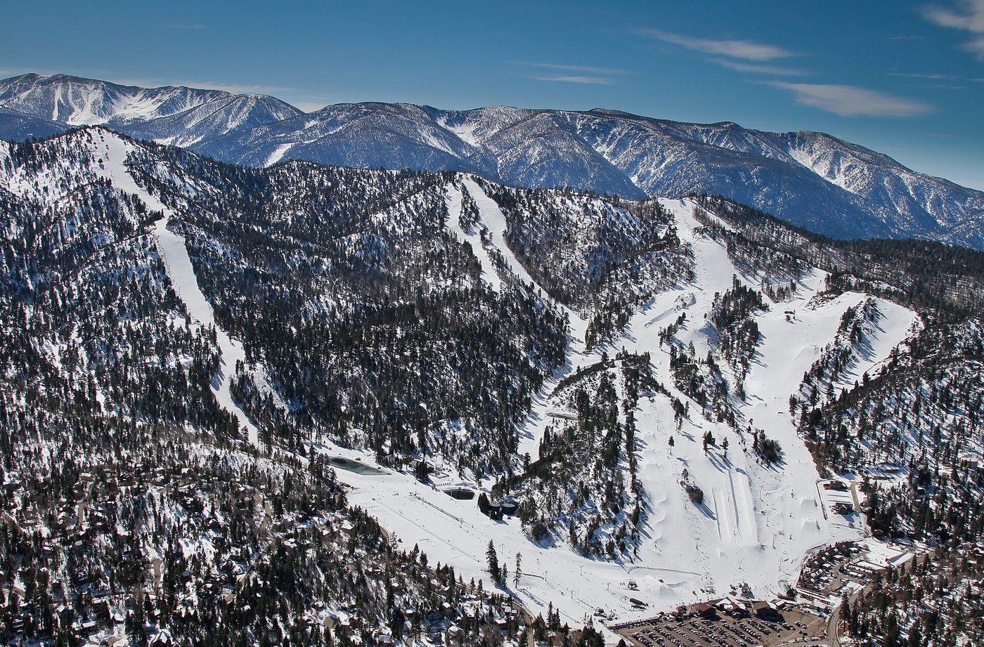 An aerial view of Bear Mountain's beginner-friendly ski runs and base village, Big Bear Lake, California