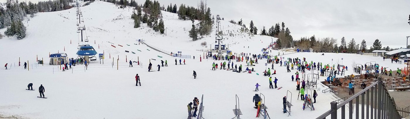 Skiers and snowboarders gather in the base area at Bogus Basin, a community-owned resort near Boise, Idaho