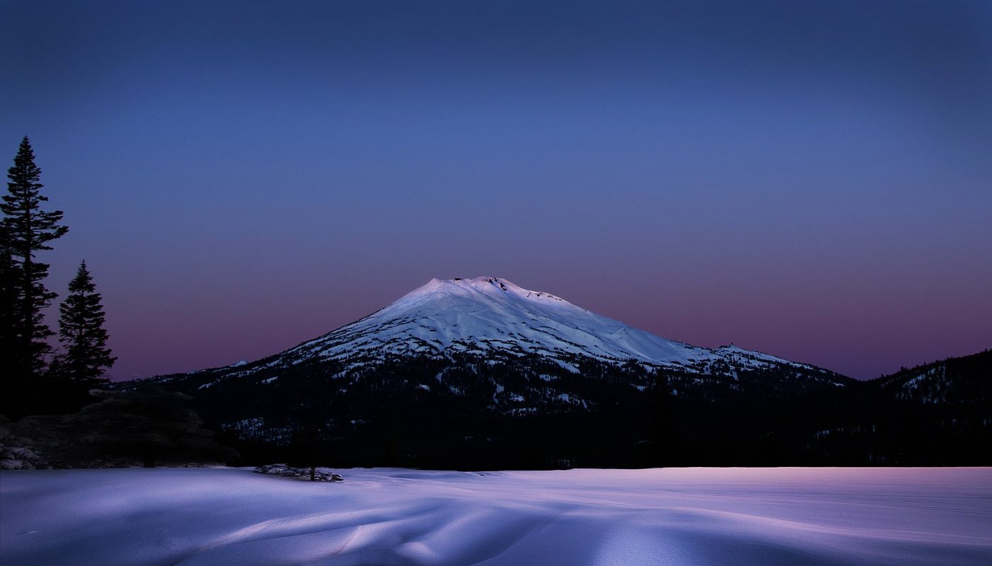 Mount Bachelor, Oregon, under snow at dawn with its ski trails visible