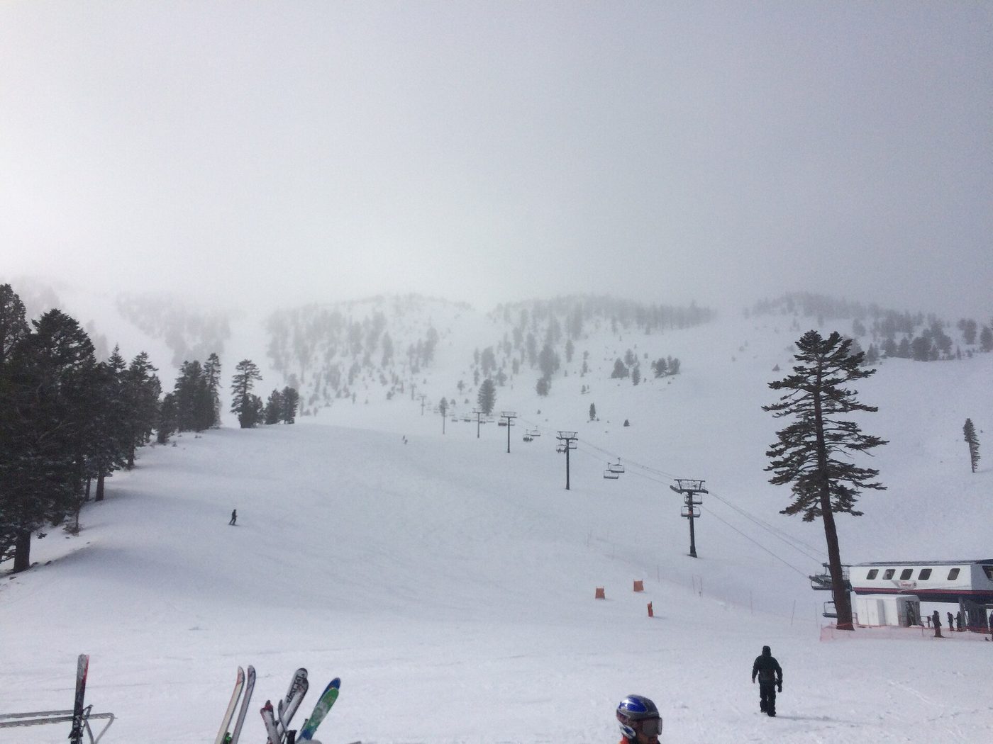A chairlift and fresh snow on the slopes at Mount Rose, Nevada, in flat light