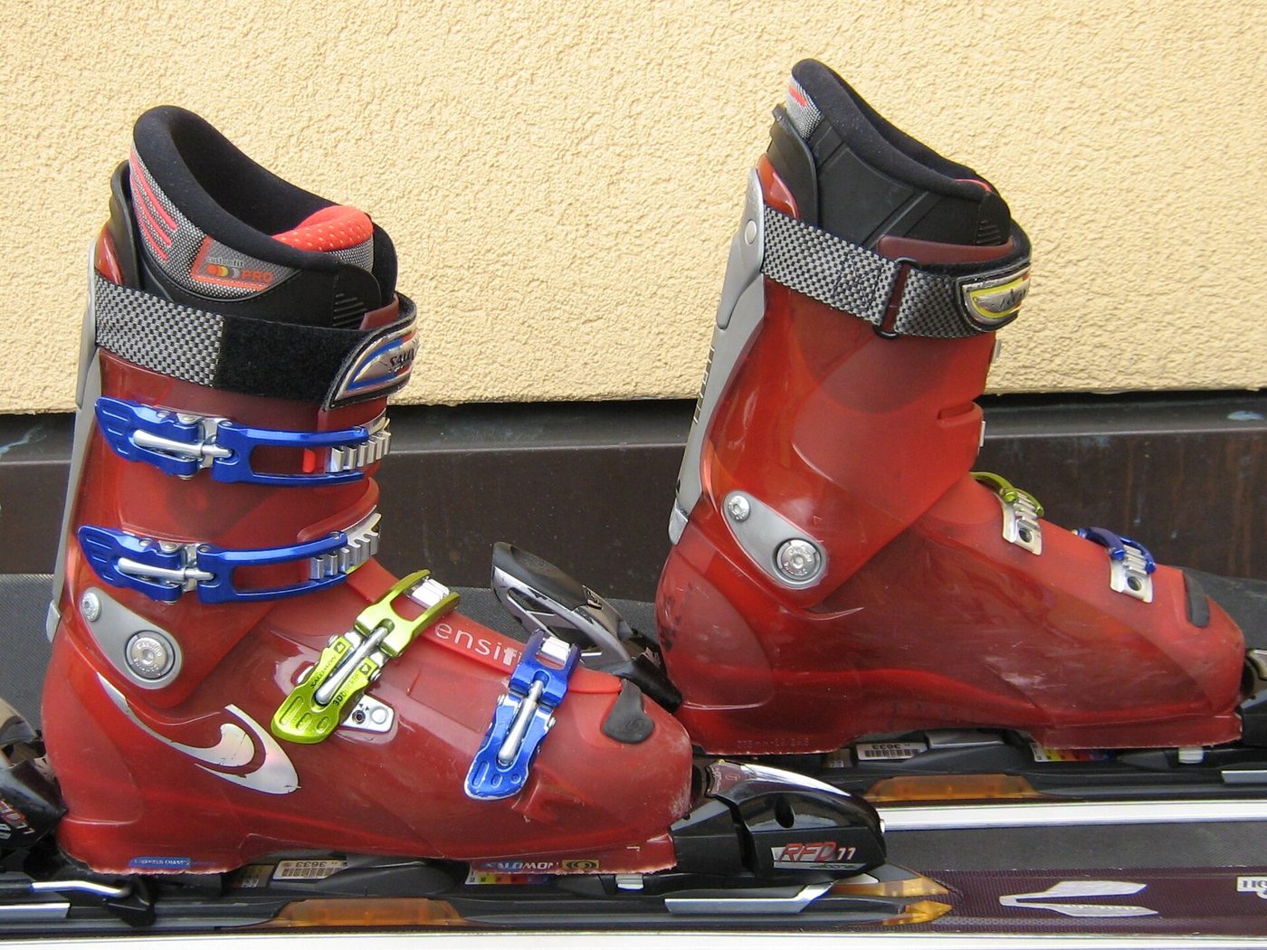 Alpine ski boots clipped into bindings on a pair of skis