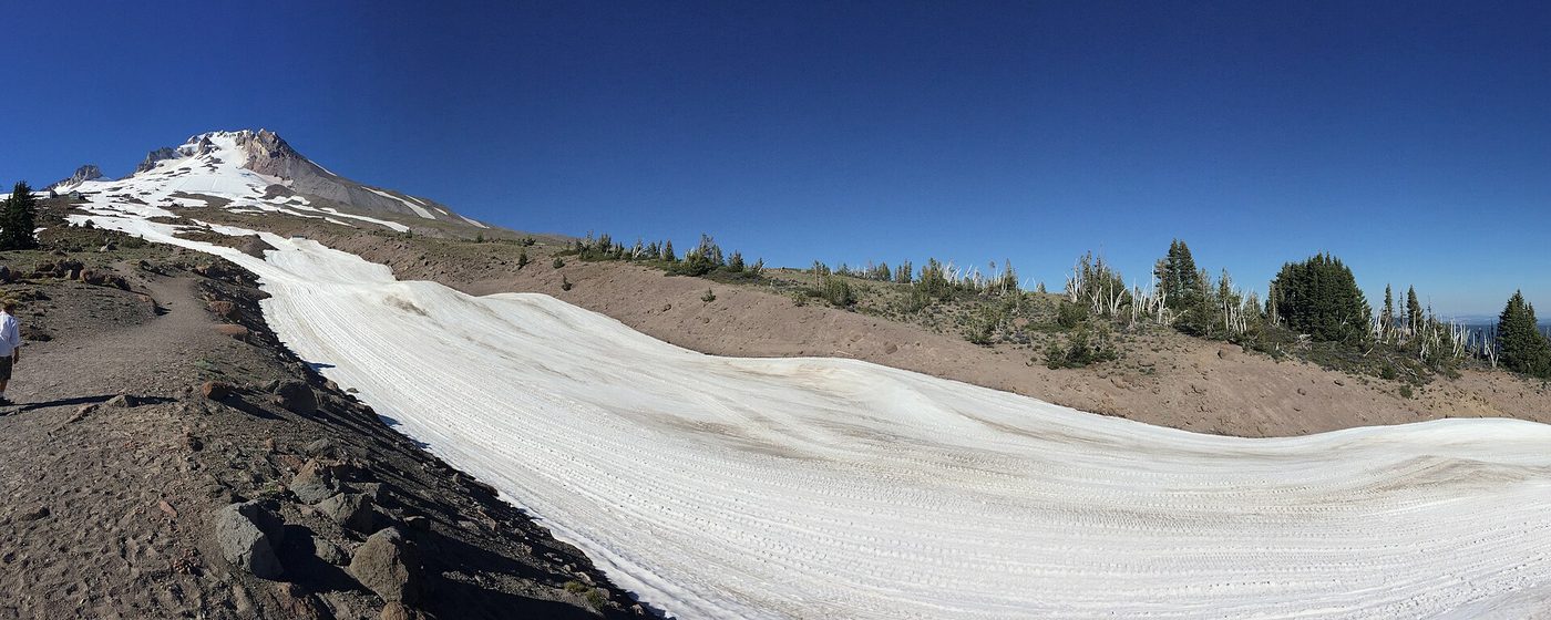 A groomed band of summer snow on the Palmer Snowfield below the summit of Mount Hood, Oregon